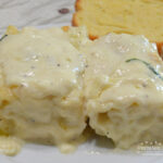 Chicken-Spinach Alfredo Roll-Ups is a comfort food meal you will want to make frequently. A mixture of ricotta, mozzarella and parmesan cheese, egg, baby spinach, and chopped rotisserie chicken are spread on a tender lasagna noodle and then rolled up. They are baked in a homemade alfredo sauce and covered with more cheese.