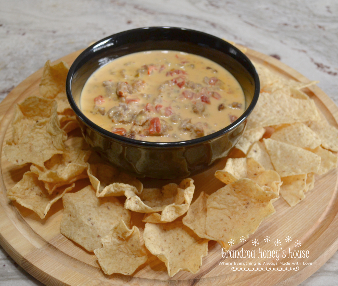 Rotel and Sausage Dip made with only 3 ingredients, is one of the most popular dips to serve at any party.&nbsp; A spicy, cheesy dip with pieces of sausage and served with Scoops or Tortillas can be made in a crockpot or on the stovetop.&nbsp;