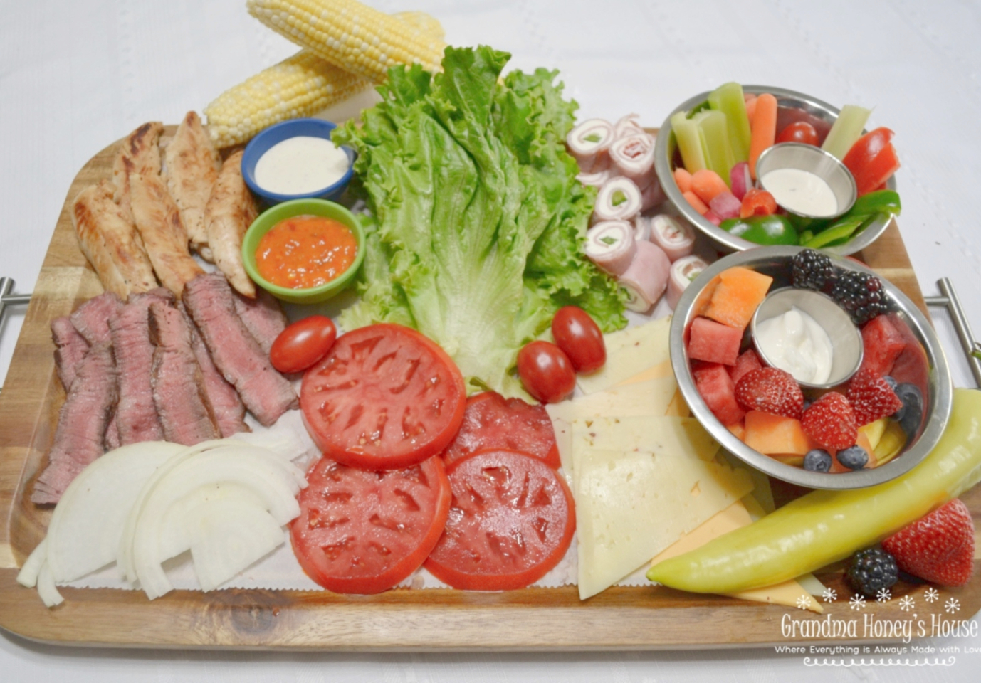 Chicken and steak wrap board with fresh veggies, fruit, and dips. An easy, customizable summer meal perfect for family dinners or casual gatherings.