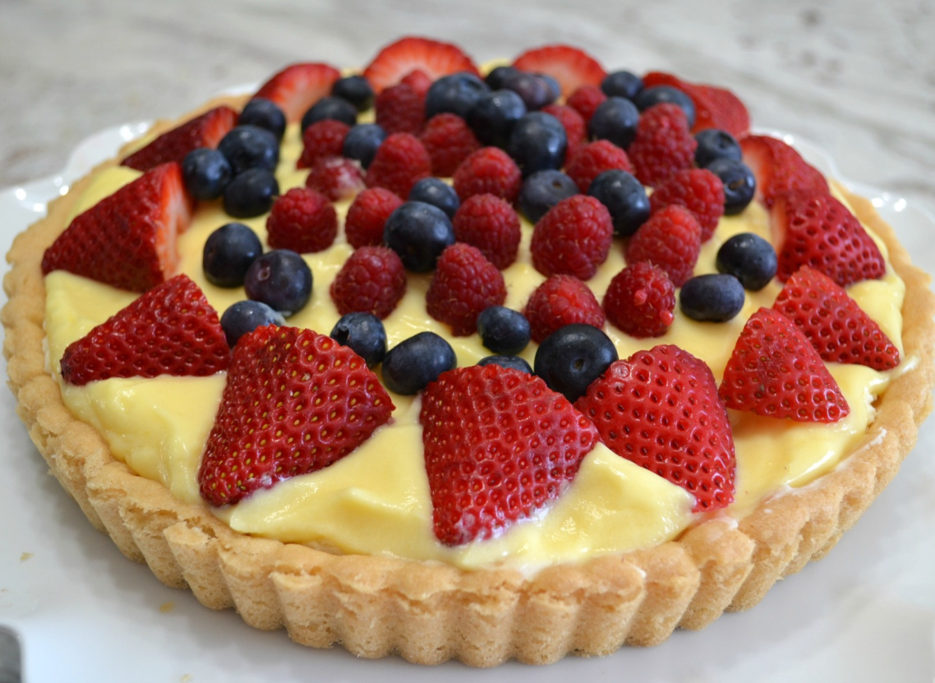 Vanilla Mascarpone Tart with fresh fruit. (Easy & Elegant Dessert). A refrigerated cookie dough crust, sweetened mascarpone layer, instant pudding and topped with fresh fruit.